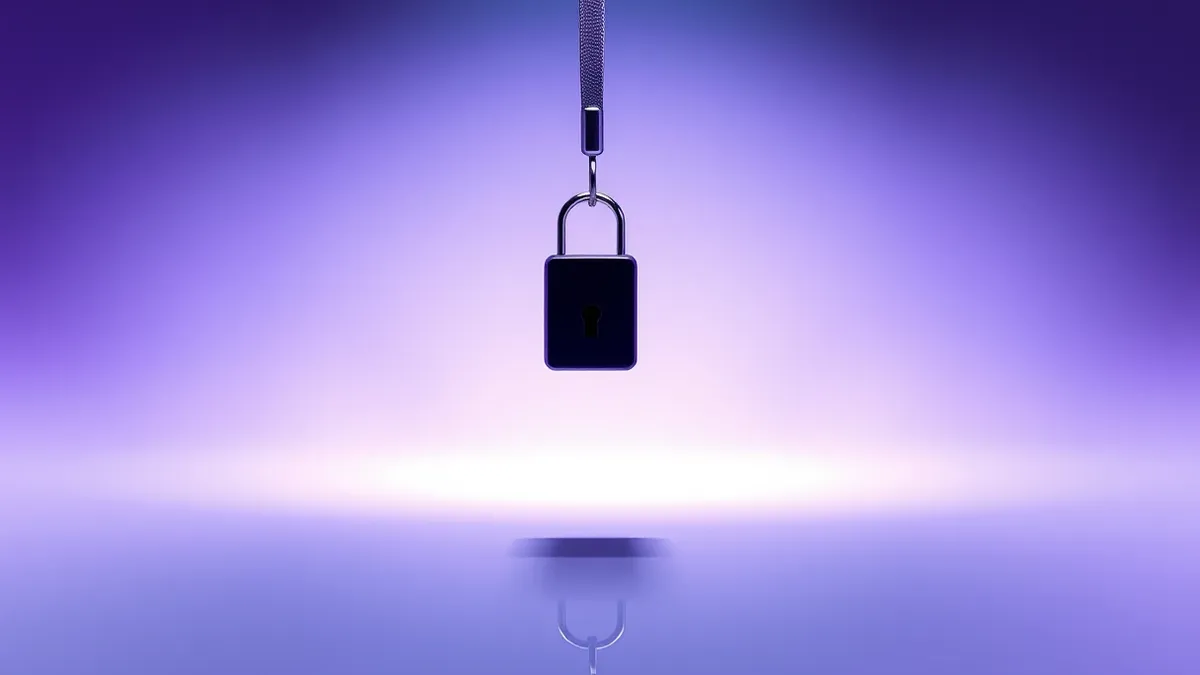 Illustration: A sleek black security key dangles from a silver lanyard, suspended in mid-air against a stark white background.